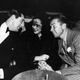 Gloria Vanderbilt surrounded by Cary Grant and Bruce Cabot, c. 1940